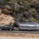 SUV pulling a silver travel trailer