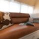 leather bench with patterned pillow