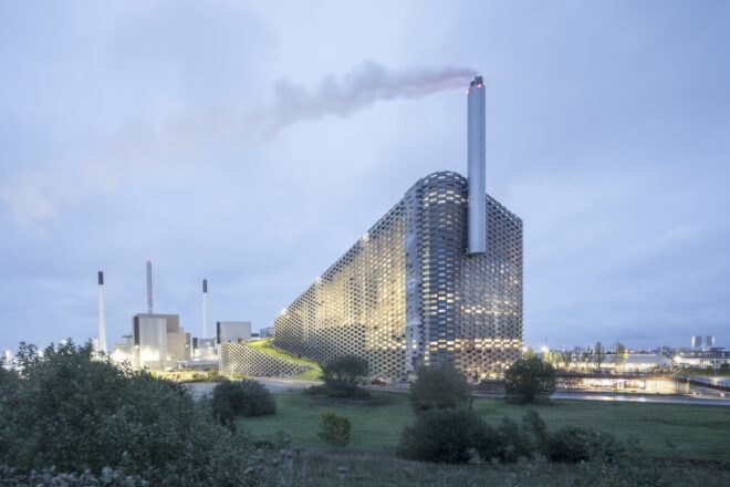 waste plant surrounded by grass and shrubs