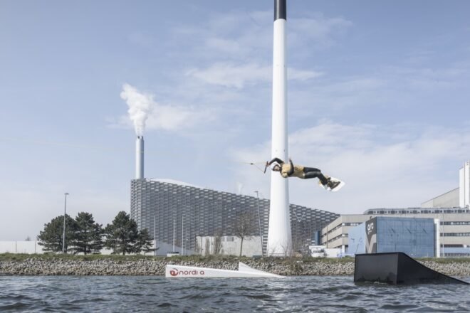 person taking part in water sports near plant