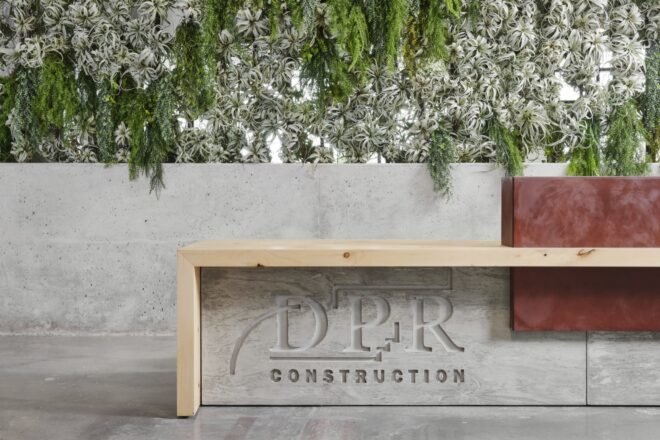 concrete bench that reads "DPR Construction"