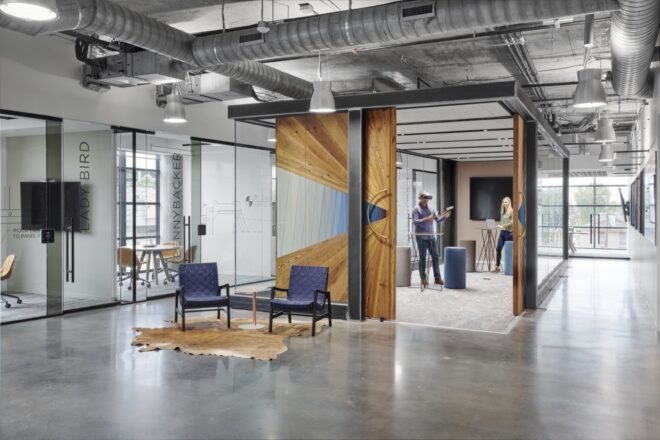 gray office with large wood door leading to an office