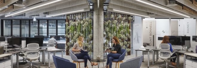office with desks and a green wall