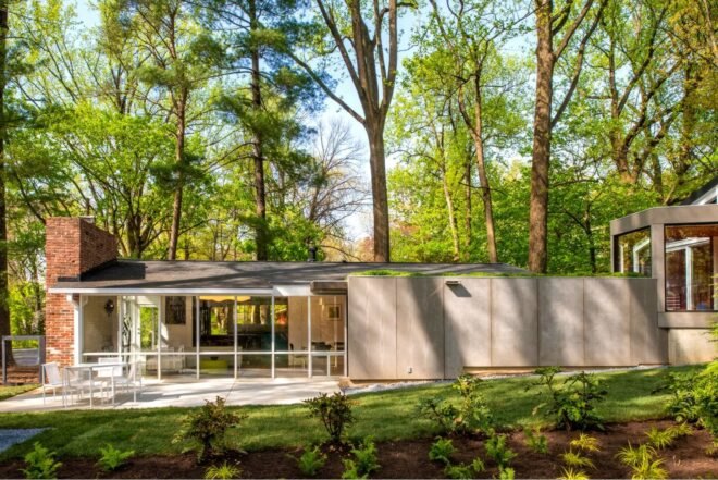 low-lying home surrounded by trees