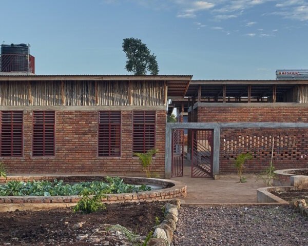 brick building surrounded by greenery