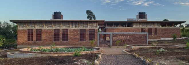 brick building surrounded by greenery