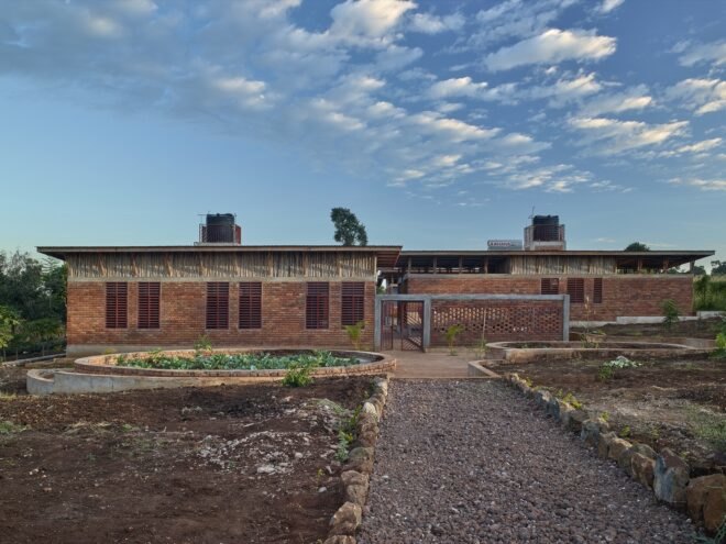 brick building surrounded by greenery
