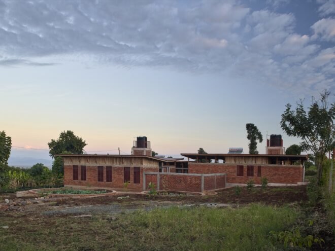 brick building surrounded by greenery