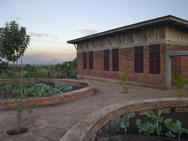 brick building surrounded by greenery
