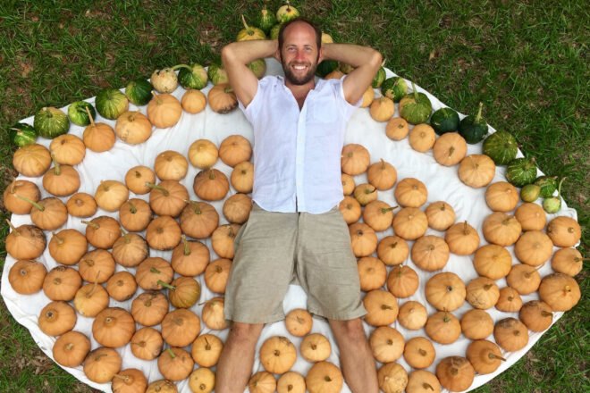 Rob lying near harvested pumpkins