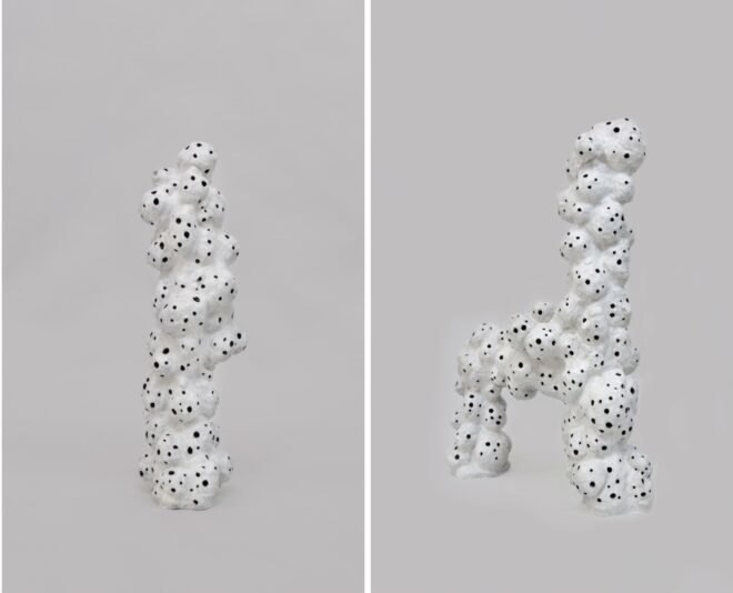 white sculptures with holes