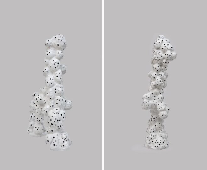 white sculptures with holes