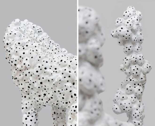 white sculptures with holes