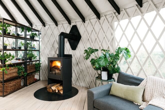 gray sofa next to wood-burning stove