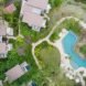 aerial view of beachfront hotel bungalows and swimming pool