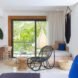 room with large sliding glass doors and mid-century modern furniture