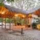 thatched roof entryway to hotel