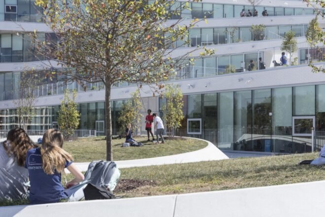 students on grassy areas with trees