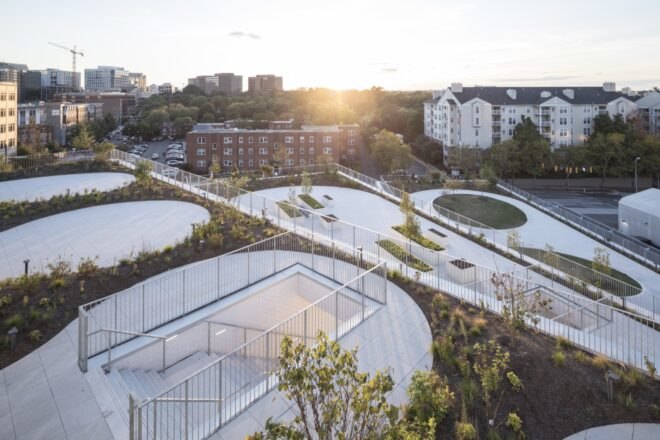 aerial view of school with staggered green terraces