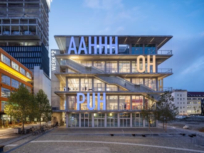 building structure with large bright letters across the building