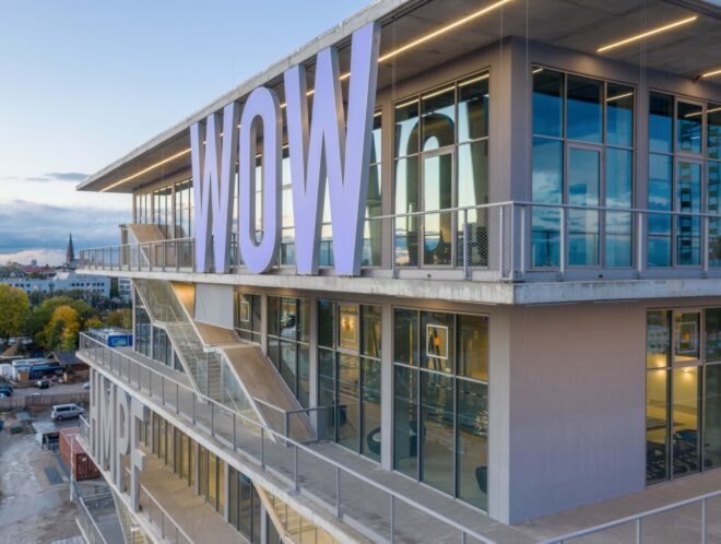 building structure with large bright letters across the building