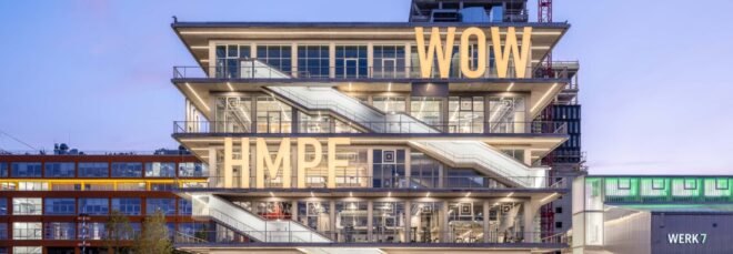 building structure with large bright letters across the building