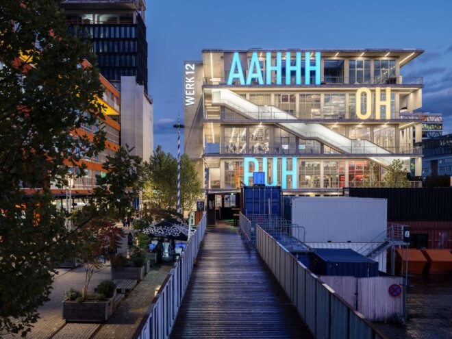 building structure with large bright letters across the building