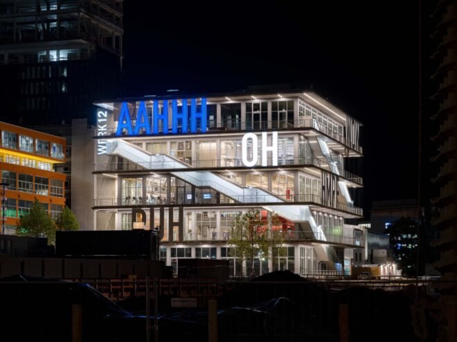 building structure with large bright letters across the building