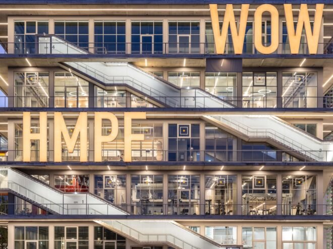 building structure with large bright letters across the building