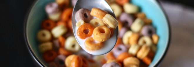 multicolored cereal and milk in a bowl