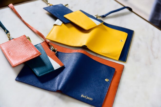 colorful passport holders and wallets on a table