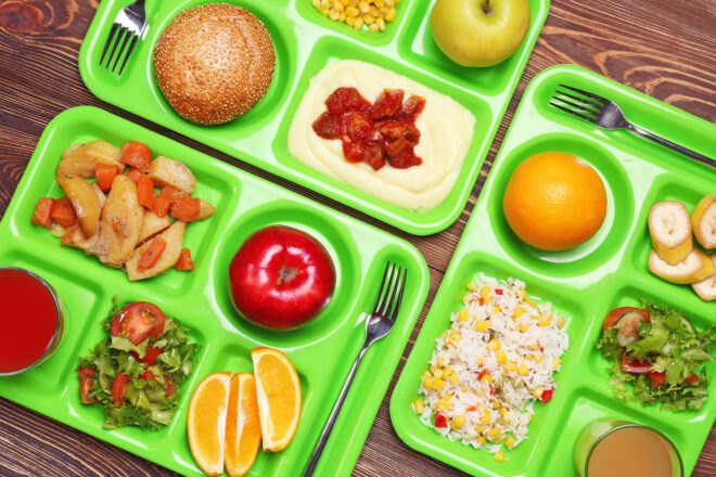 lunch items on green trays