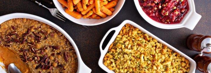 All traditional Thanksgiving side dishes, roasted carrots, sweet potato casserole, cranberry sauce and stuffing