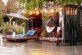 floating cabin with string lights on water