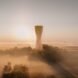rendering of tower in smoggy city