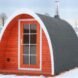 igloo-shaped red wooden sauna