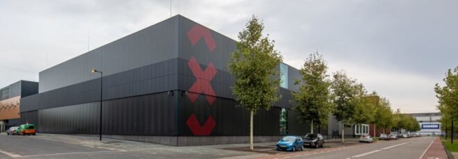 black building with three red Xs on it