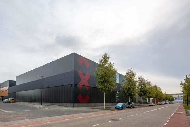 black building with three red Xs on it