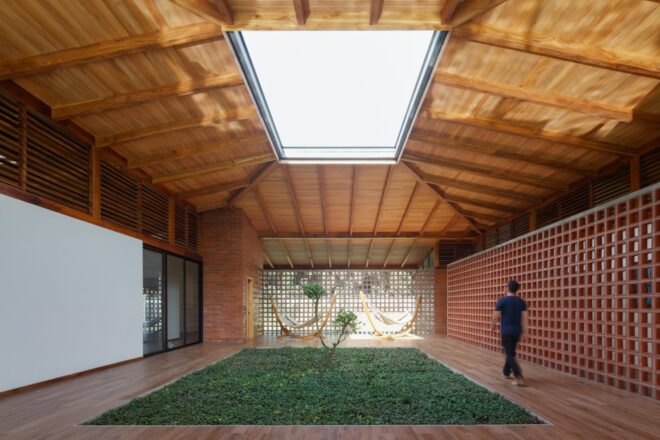 wooden home with courtyard and large skylight