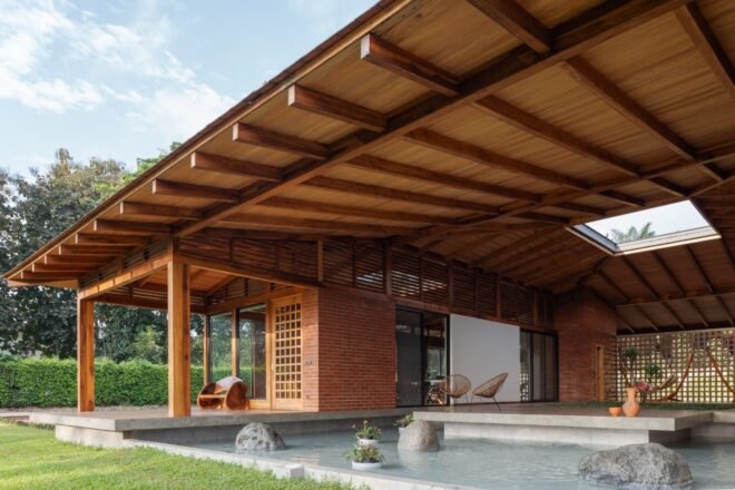 wooden home with courtyard and pool