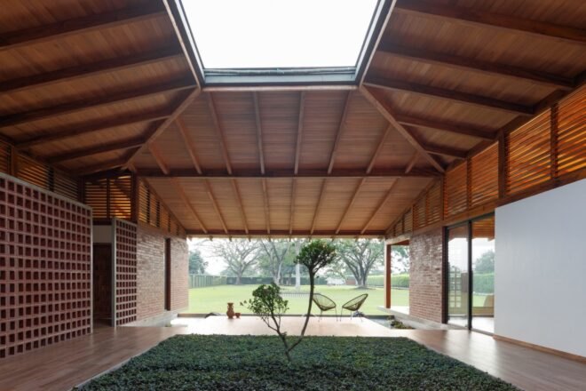 wooden home with courtyard and large skylight