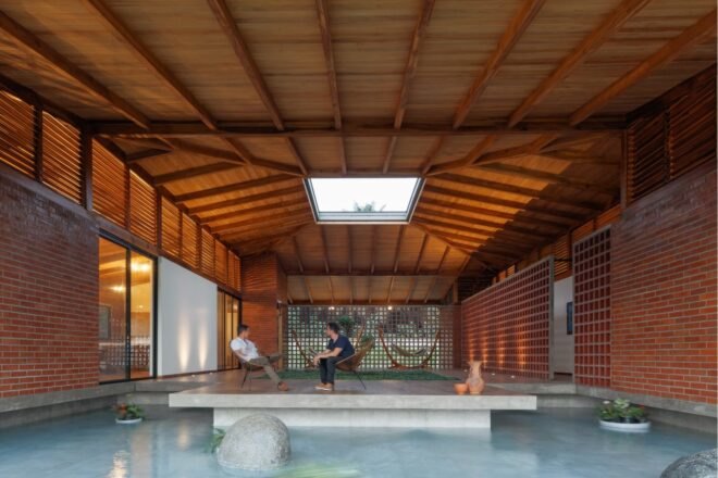 pool under a wood roof with a skylight