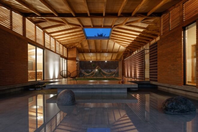 water feature under a wood roof with skylight at night