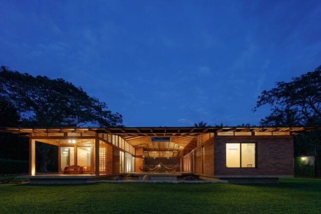 single-story home with large courtyard at night
