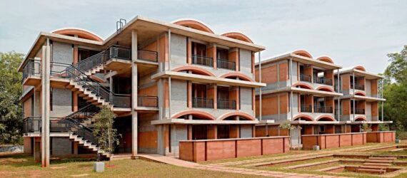 three-level brick housing complex with domed roofs