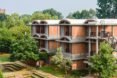 three-level brick housing complex with domed roofs