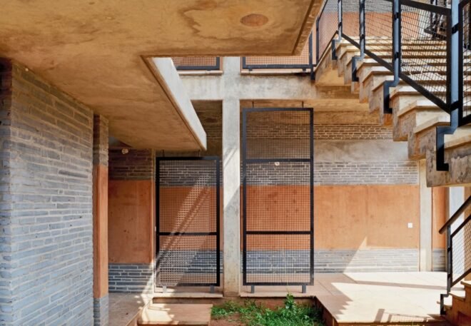 walkway around housing development with iron screen