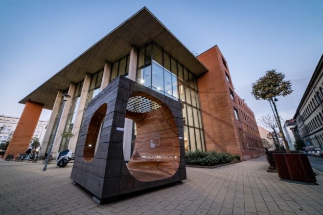 wood cube structure with benches inside