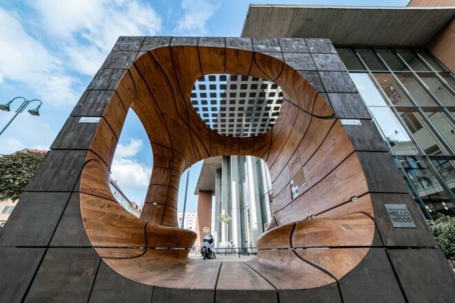 side view of large wooden cube with openings on three sides