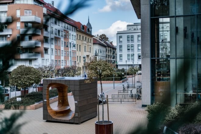large wooden cube in a public square